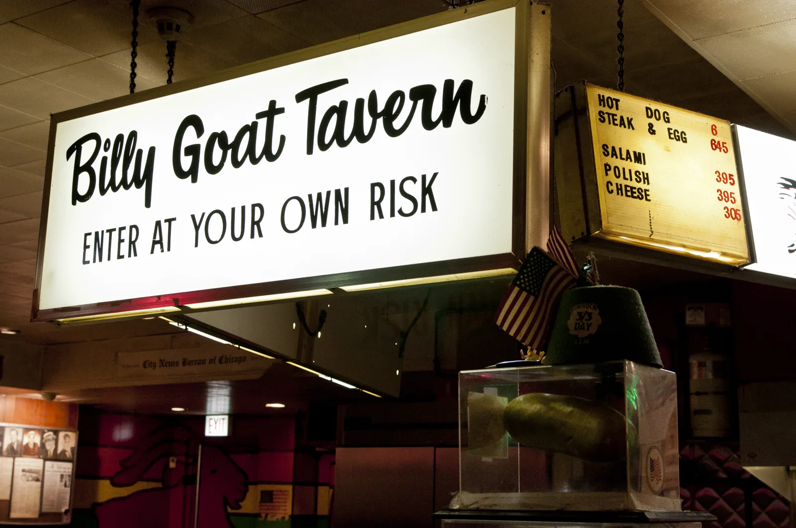 The hanging Billy Goat Tavern sign and menu board inside the original tavern