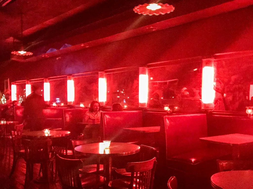 The California Clipper Lounge storefront, porthole door, and red neon on California Avenue