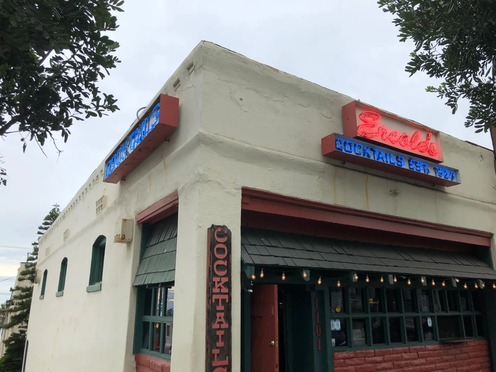 Ercole's neon sign and striped awning on Manhattan Ave