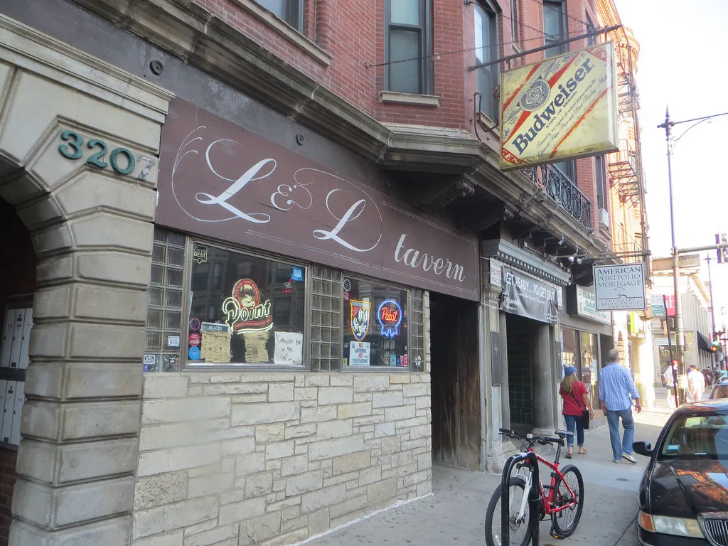 L&L Tavern on Clark Street, with the script sign, neon windows, and sidewalk