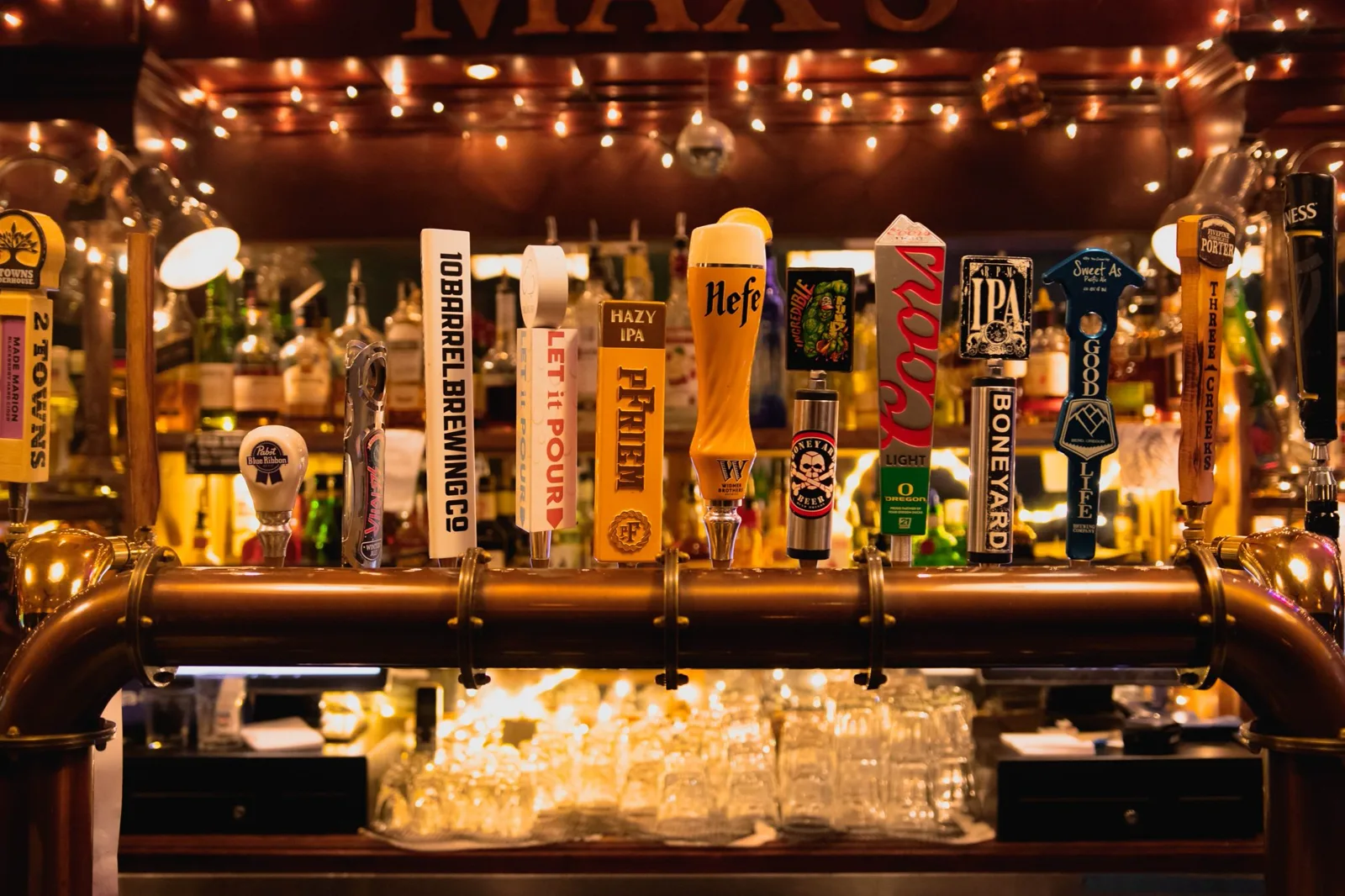 The brass tap rail and MAX'S header over Oregon drafts and a Pabst Blue Ribbon handle