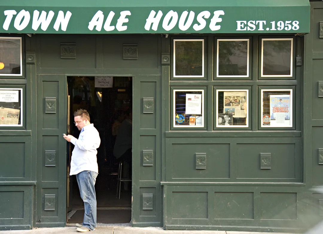 The green awning and paneled facade of Old Town Ale House