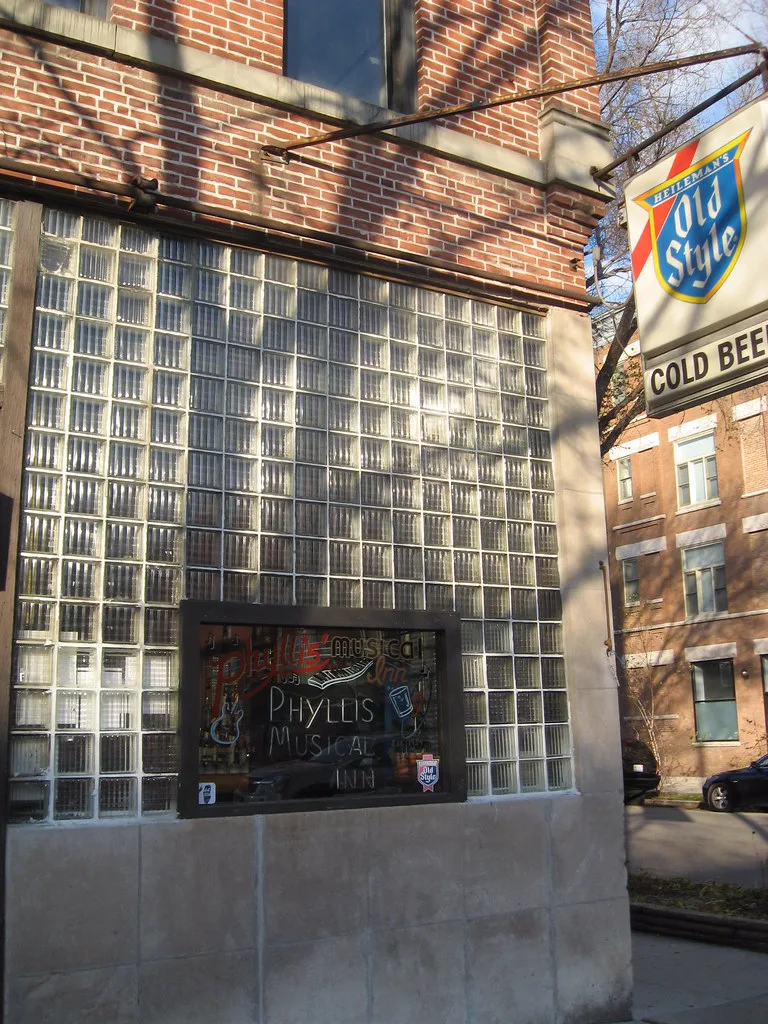 The Old Style cold-beer sign and painted window at Phyllis' Musical Inn on Division Street