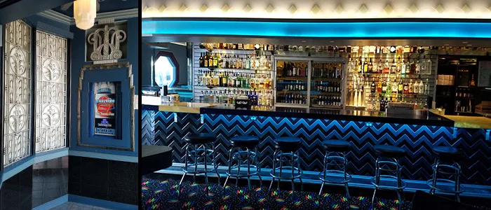 Silver Fox bar with a glowing Silver Fox sign, a packed counter, and rainbow flags