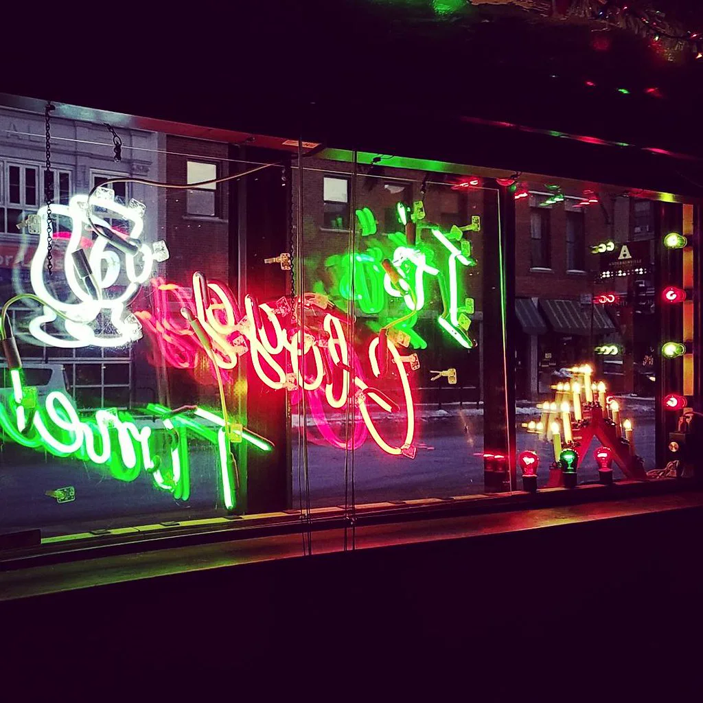 Neon Simon's Tavern window lettering looking out onto Clark Street