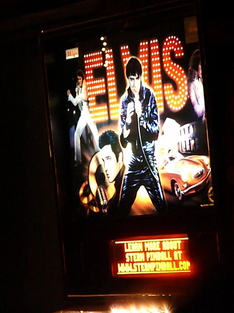 The lighted Elvis pinball machine in a dark corner of Skylark