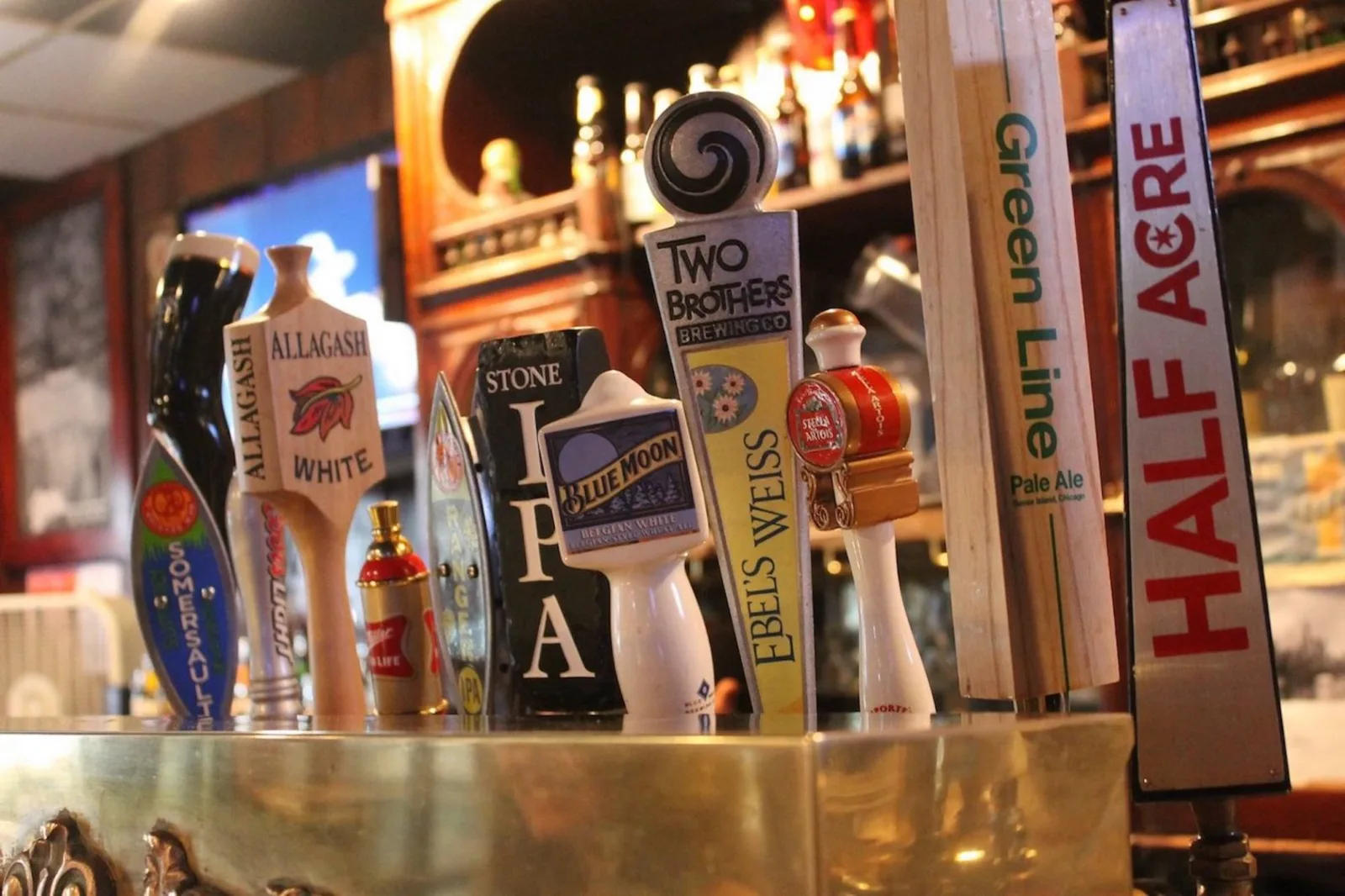 Draft handles along the Stocks & Blondes rail, including Half Acre and Goose Island Green Line