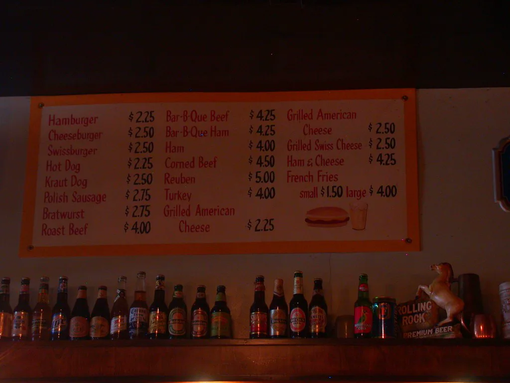 The inexpensive food board and beer-bottle shelf at Jimmy's Woodlawn Tap